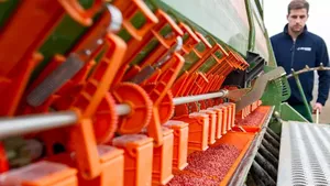 Farmer with heavy machinery in the field