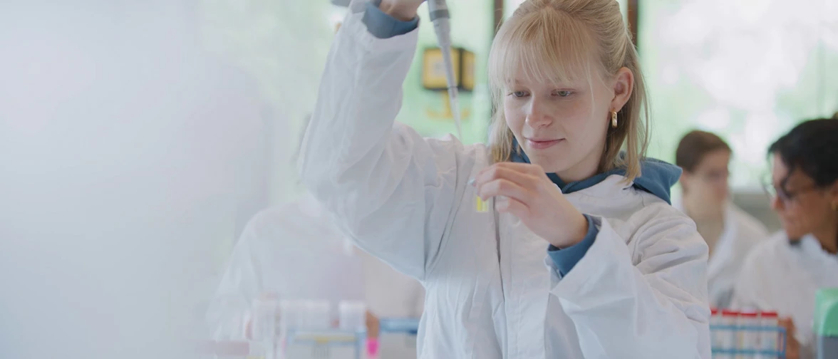 Life Sciences Nutrition student pipetting.